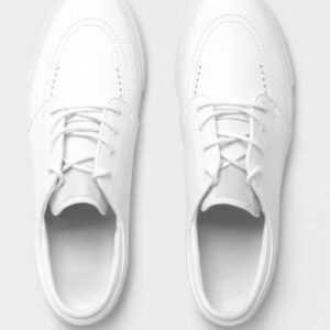 Top view of white plain pair of shoes on isolated background.